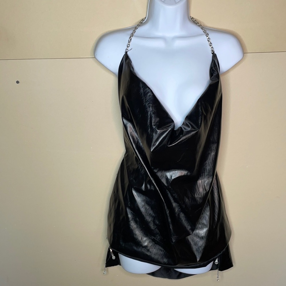 Pleather fabric open back with chains and gems.
